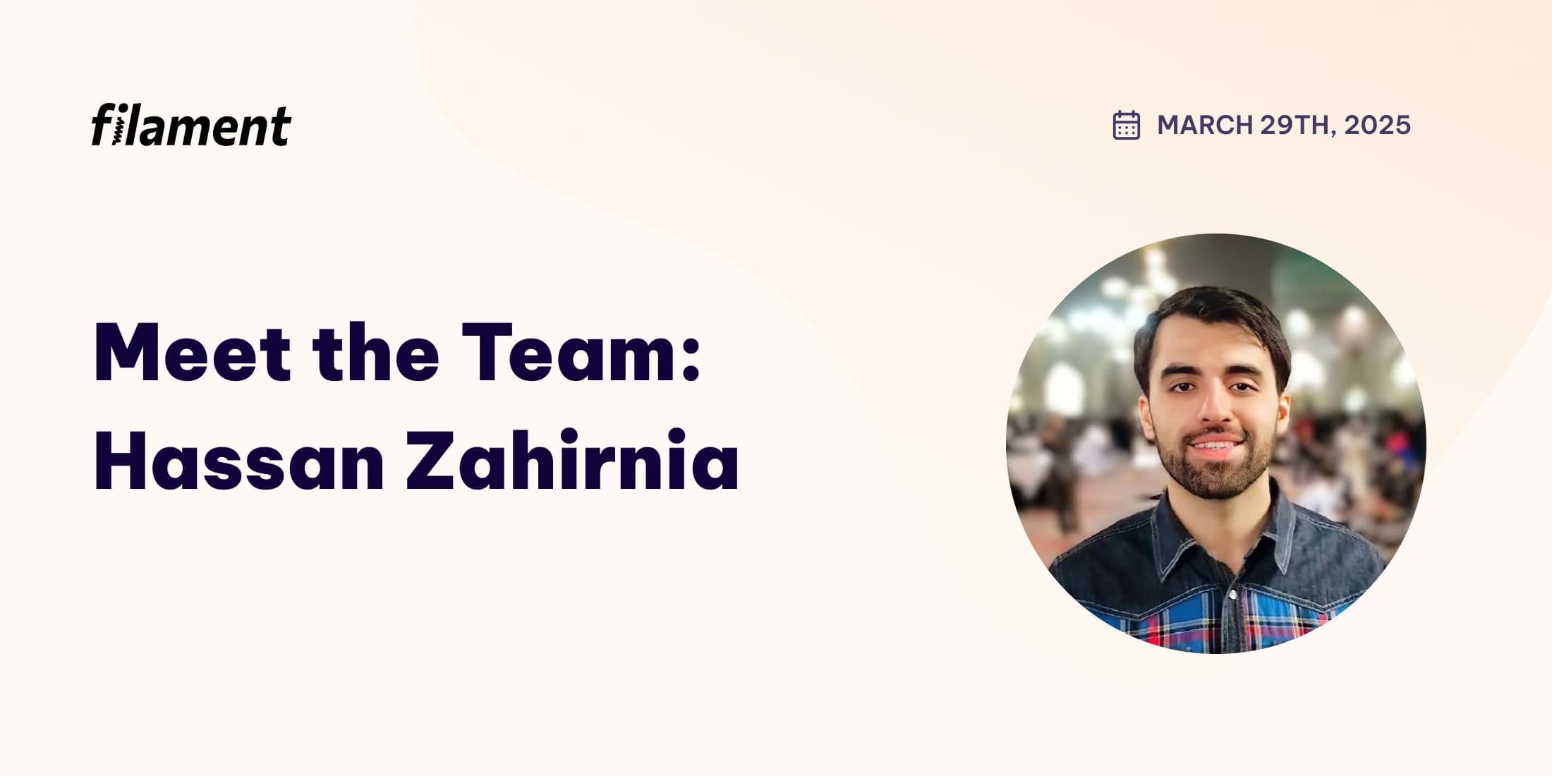 An image with the words 'Meet the Team: Hassan Zahirnia' on the left, and a photo of Hassan in a multi-colored button-up shirt on the right.